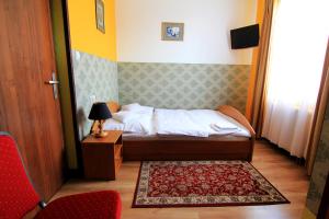 Postel nebo postele na pokoji v ubytování FusGym Resort