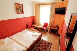 Postel nebo postele na pokoji v ubytování FusGym Resort
