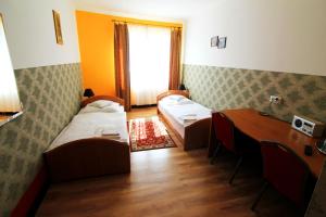Postel nebo postele na pokoji v ubytování FusGym Resort