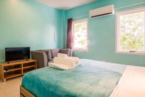 Postel nebo postele na pokoji v ubytování Bed & Bike Curacao