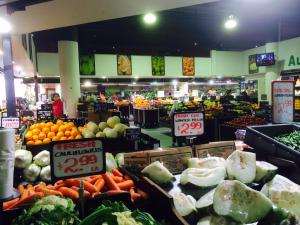 a market with fruits and vegetables in a store at Box Hill Studio Apartment 2 in Box Hill