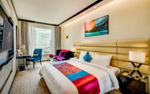 Postel nebo postele na pokoji v ubytování NagaWorld Hotel & Entertainment Complex