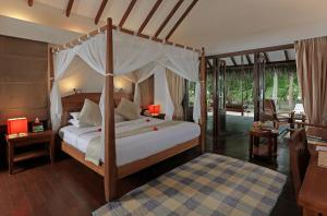 Postel nebo postele na pokoji v ubytování Medhufushi Island Resort