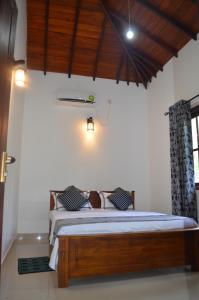 Postel nebo postele na pokoji v ubytování Aroma Villa Homestay