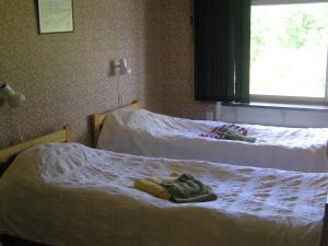 Postel nebo postele na pokoji v ubytování Fredrika Hotell Jakt&Fiskecamp
