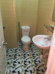 a bathroom with a toilet and a sink at Bao Thy Hotel in Chau Doc