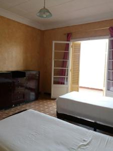 Katil atau katil-katil dalam bilik di Hotel Le Gardenia (ex Lutetia)