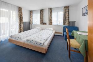 Postel nebo postele na pokoji v ubytování Hotel Rhodania