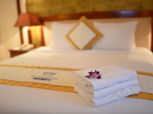 Postel nebo postele na pokoji v ubytování Palace Hotel Vung Tau