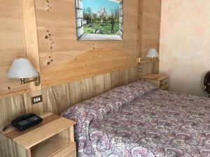 Cama o camas de una habitación en Grand Hotel Ala di Stura