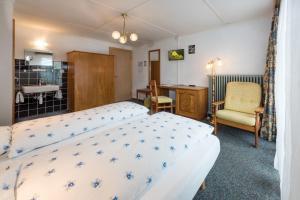 Postel nebo postele na pokoji v ubytování Hotel Rhodania