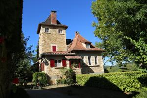 an old house with a tower on top of it at Domaine du Bouysset in Saint-Martin-le-Redon