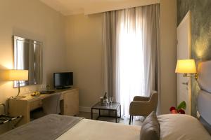 Postel nebo postele na pokoji v ubytování Thermae Sylla Spa & Wellness Hotel