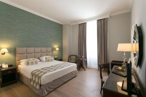 Postel nebo postele na pokoji v ubytování Thermae Sylla Spa & Wellness Hotel