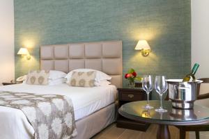 Postel nebo postele na pokoji v ubytování Thermae Sylla Spa & Wellness Hotel