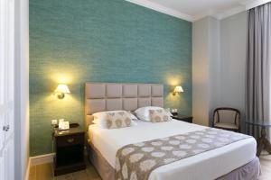 Postel nebo postele na pokoji v ubytování Thermae Sylla Spa & Wellness Hotel