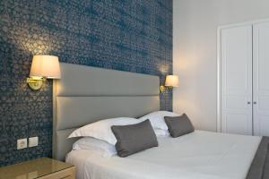 Postel nebo postele na pokoji v ubytování Thermae Sylla Spa & Wellness Hotel