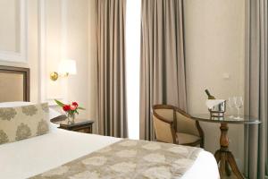 Postel nebo postele na pokoji v ubytování Thermae Sylla Spa & Wellness Hotel