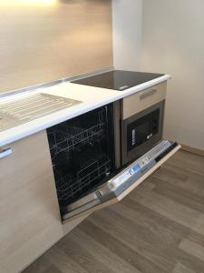 a dishwasher in a kitchen with a counter top at Boutique Suite Mim-A in Antalya