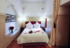 Postel nebo postele na pokoji v ubytování Riad Dar Justo Hotel Boutique & Spa