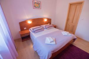 Postel nebo postele na pokoji v ubytování Apartments Villa Kristina