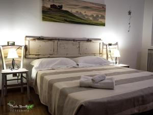 Postel nebo postele na pokoji v ubytování Bed and Breakfast AnnA