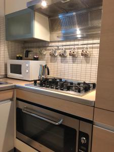 A kitchen or kitchenette at La Porta Nel Giardino
