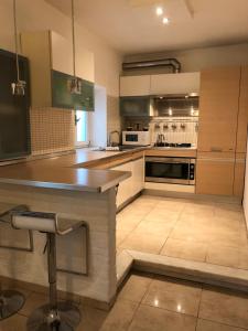 A kitchen or kitchenette at La Porta Nel Giardino