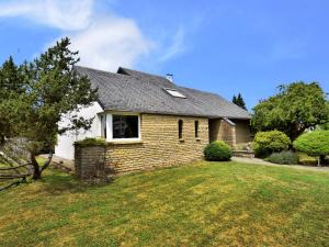 a brick house with a window and a yard at Holiday Home in Virton with swimming pool in Virton