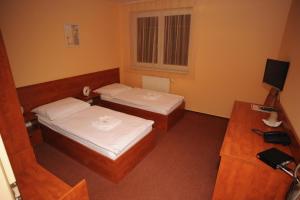 Letto o letti in una camera di Hotel Olympionik