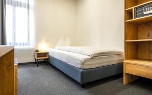 Hotel Ochsen by Mountain Hotels客房内的一张或多张床位