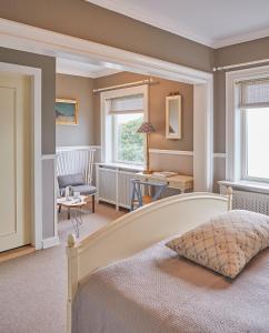 Postel nebo postele na pokoji v ubytování Gilleleje Badehotel