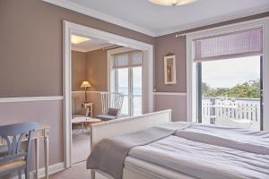 Postel nebo postele na pokoji v ubytování Gilleleje Badehotel