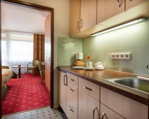 Kuchyň nebo kuchyňský kout v ubytování Johannesbad Thermalhotel Ludwig Thoma