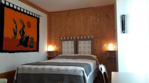 Postel nebo postele na pokoji v ubytování Petite Suite Douillette