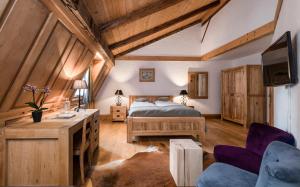 Postel nebo postele na pokoji v ubytování Romantik Hôtel l'Etoile