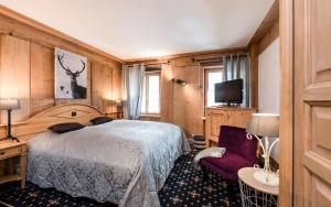 Postel nebo postele na pokoji v ubytování Romantik Hôtel l'Etoile