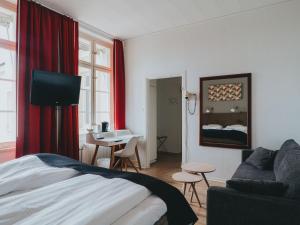 Säng eller sängar i ett rum på Arboga Stadshotell