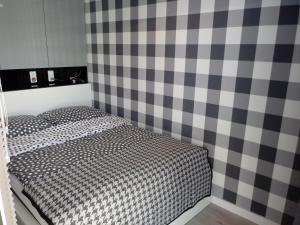 Łóżko lub łóżka w pokoju w obiekcie Apartament na Złotej