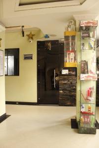 a room with a large black door in a room at Motel Piramides De Cristal in Bogotá