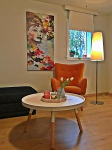 a living room with a coffee table and a couch at Apartment 19 in Selfoss