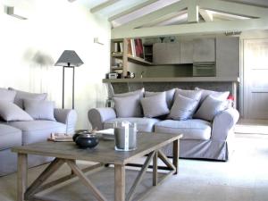a living room with couches and a coffee table at Maison RR in Saint-Tropez