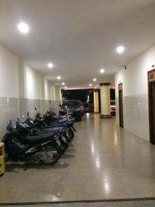 a row of motorcycles parked in a parking garage at Bắc Nam Hotel in Da Nang
