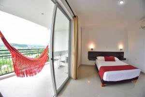Säng eller sängar i ett rum på Hotel Montserrat Plaza