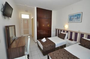Postel nebo postele na pokoji v ubytování Reis Maris Hotel