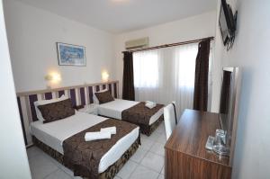 Postel nebo postele na pokoji v ubytování Reis Maris Hotel