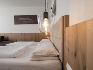 Una cama o camas en una habitación de Valavier Aktivresort