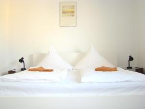 Voodi või voodid majutusasutuse Rooms & Apartments near Zoologischer Garten toas