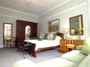 Tempat tidur dalam kamar di Villa Zeezicht
