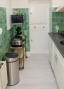 A cozinha ou cozinha compacta de Appartement Beauvilliers